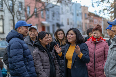 Ling Ye with local families at a neighborhood gathering