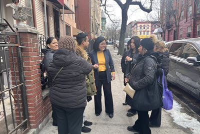 Ling Ye with local families at a neighborhood gathering